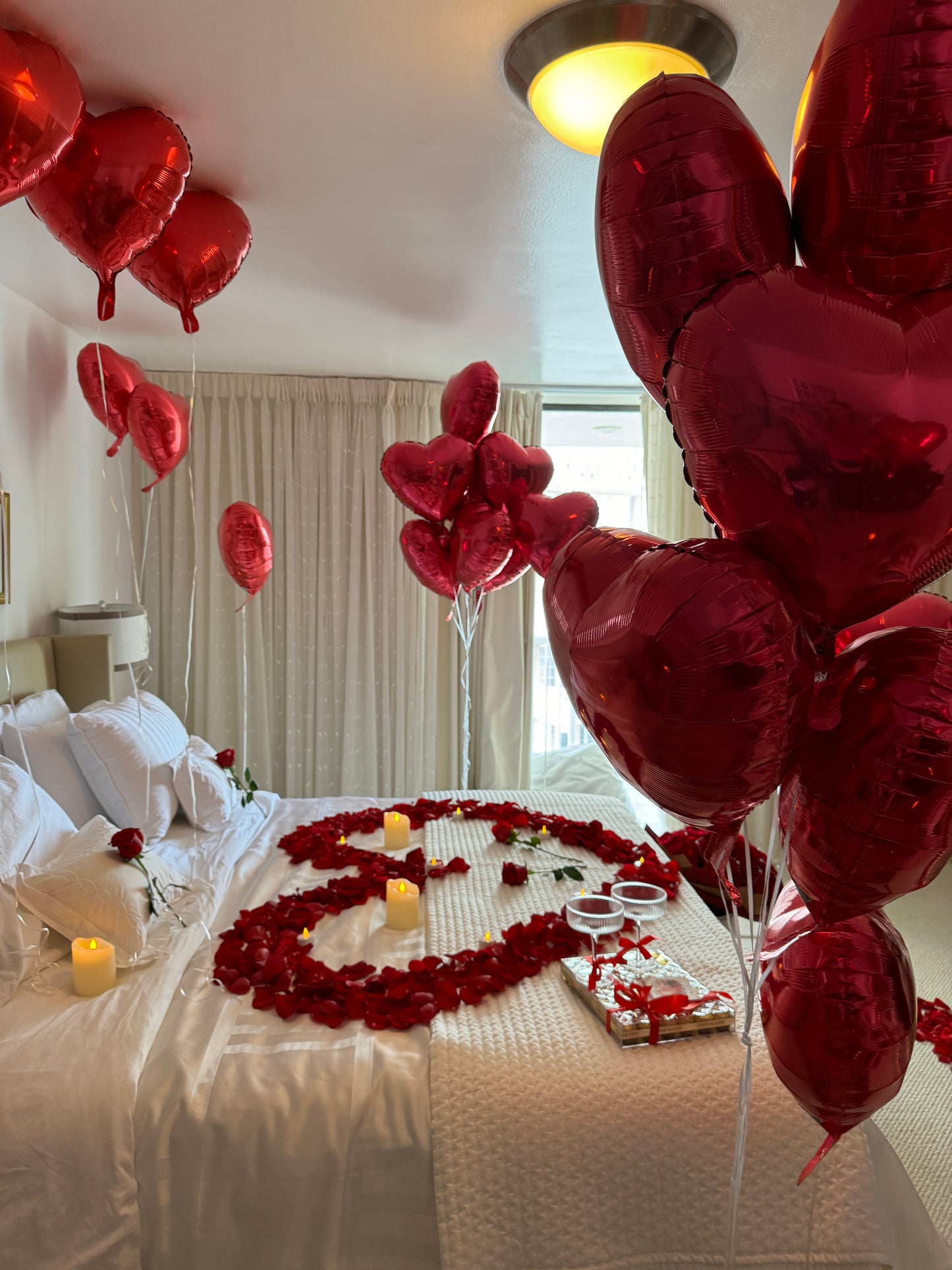 Romantic Room Decoration, 100 Red Rose Bouquet, Petals, Balloons, Candles & Chocolate - Miami Flower Store Same-Day Delivery Fort Lauderdale Brickell Aventura Las Olas Hallendale Beach Hollywood Sunny Isles