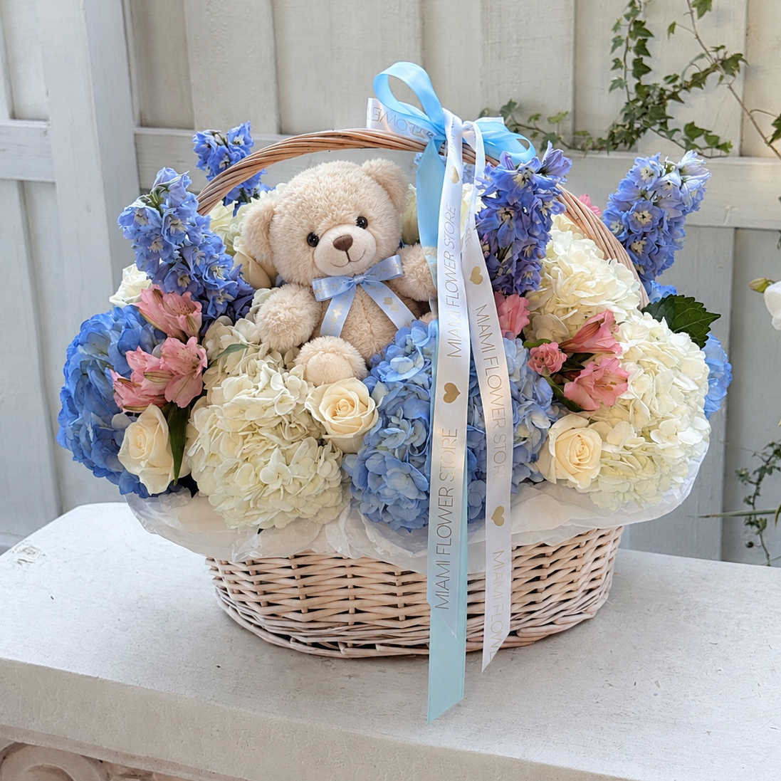 Teddy Bear & Blue Flower Basket With Hydrangea, Roses & Delphinium| MiamiFlowerStore