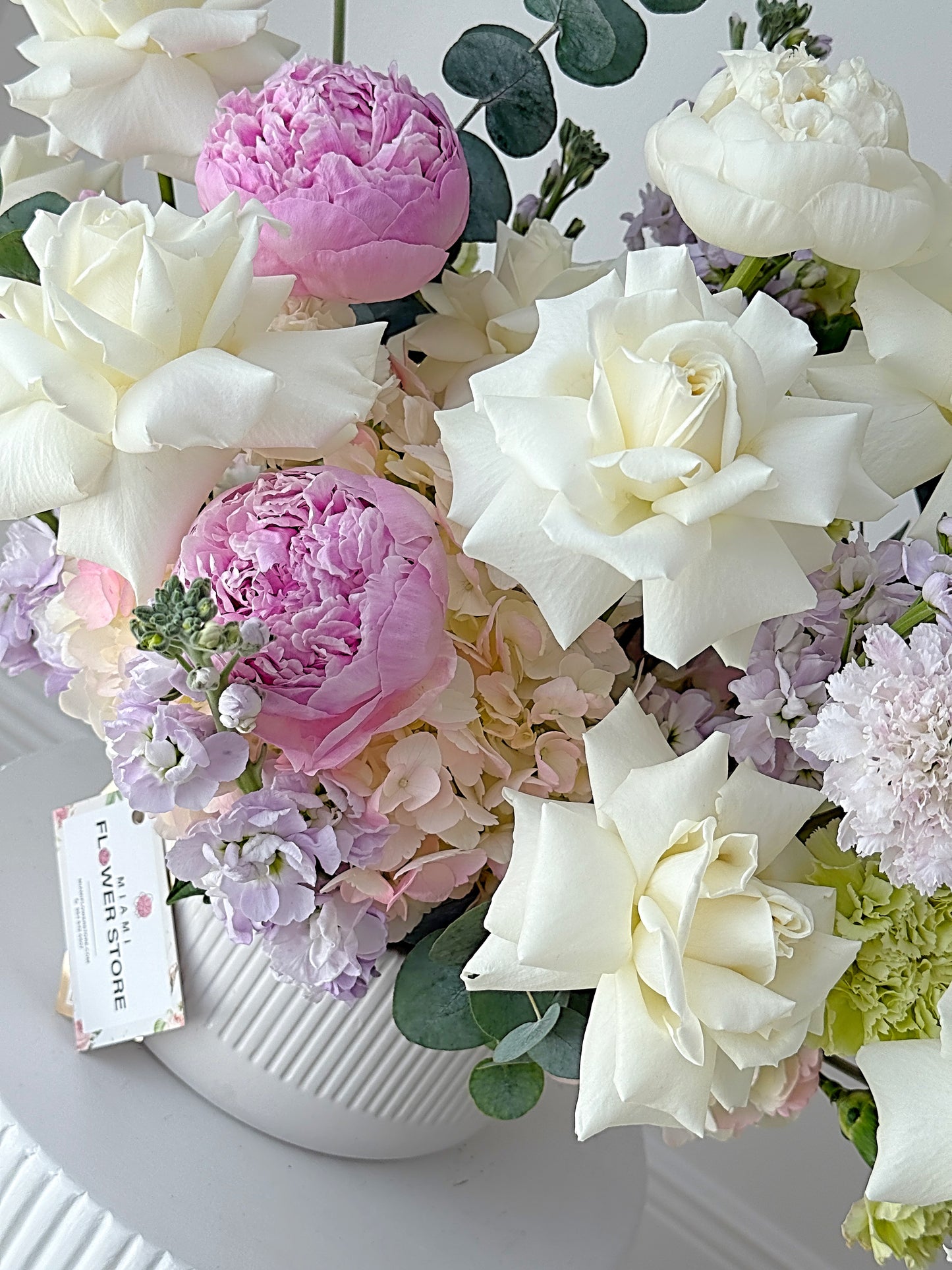 Centerpiece From White Flowers, Stock & Carnations In A Ceramic Vase - Miami Flower Store Same-Day Delivery Fort Lauderdale Brickell Aventura Las Olas Hallendale Beach Hollywood Sunny Isles