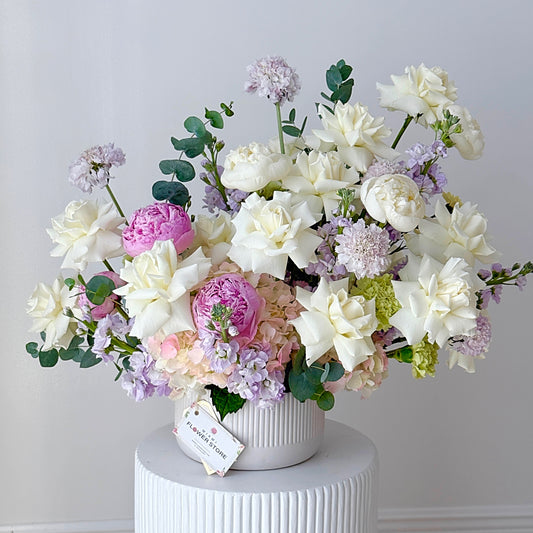 Centerpiece From White Flowers, Stock & Carnations In A Ceramic Vase - Miami Flower Store Same-Day Delivery Fort Lauderdale Brickell Aventura Las Olas Hallendale Beach Hollywood Sunny Isles