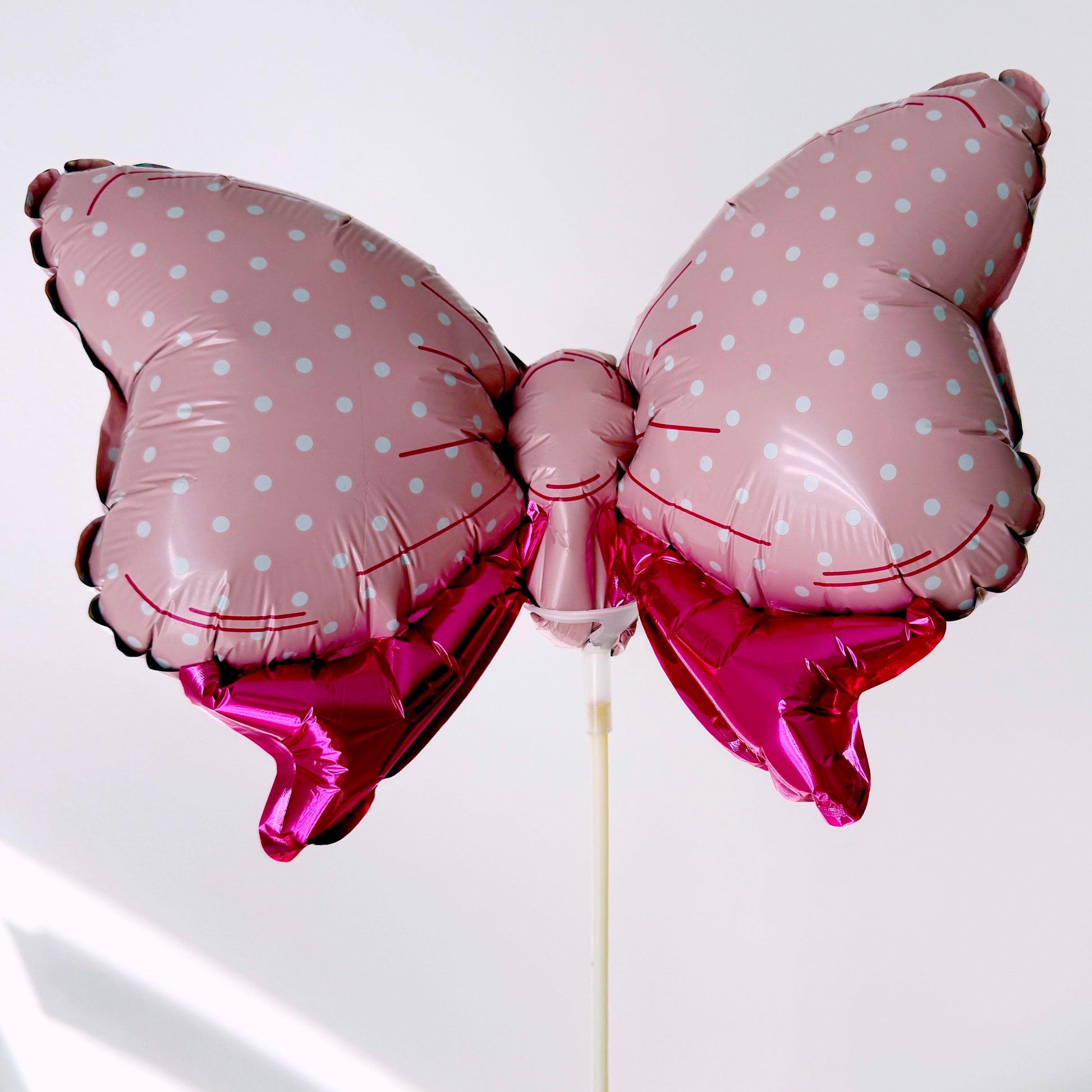 Small Pink Bow Shaped Metallic Foil Balloon On A Stick - 11''x 8'' - Miami Flower Store Same-Day Delivery Fort Lauderdale Brickell Aventura Las Olas Hallendale Beach Hollywood Sunny Isles